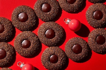 Baked cookies placed decoratively on a red background. 